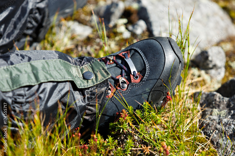 Shoes for mountain trekking on foot of the tourist. Shoes for mountain trekking on foot of the tourist.