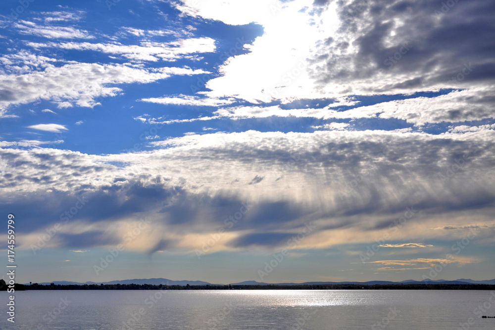 Sunshine over Lake Champlain on the border of Upstate New York and Vermont on Rouses Point Bridge, Vermont, USA.