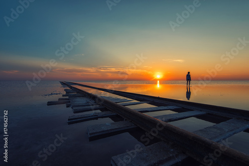 Woman at beauty sunset on s...