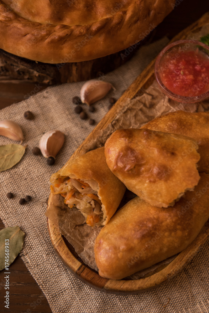 Fototapeta premium Different pies from meat and vegetables. Freshly baked cakes on a table