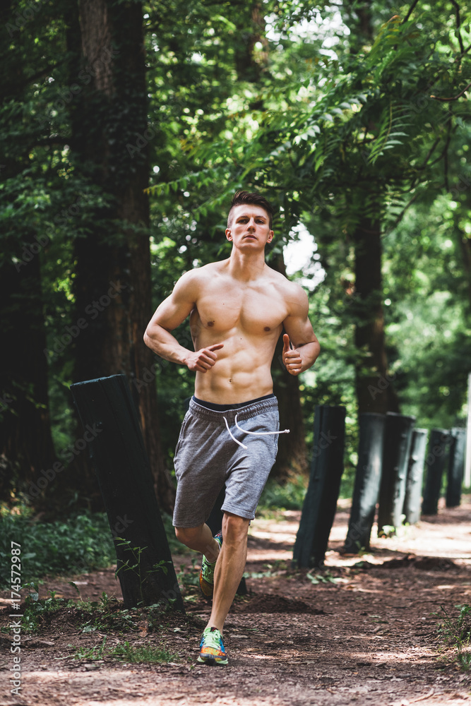 Young fit man running in the park Young fit man running in the park