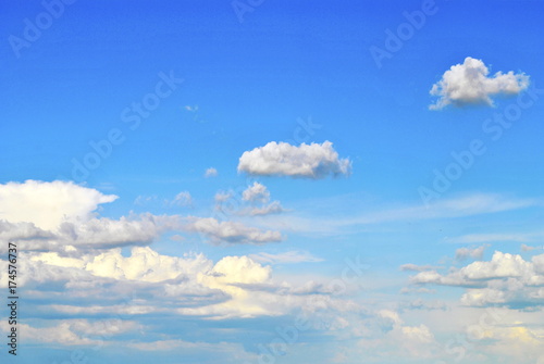 Light blue sky with clouds.