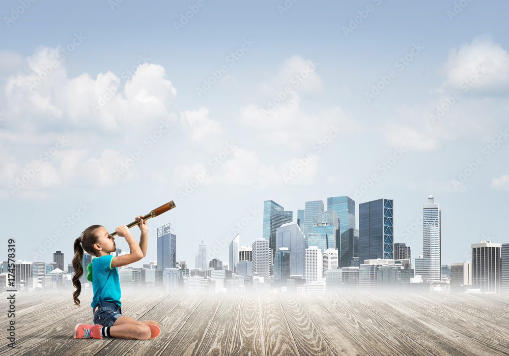 Concept of careless happy childhood with girl dreaming about future Concept of careless happy childhood with girl dreaming about future