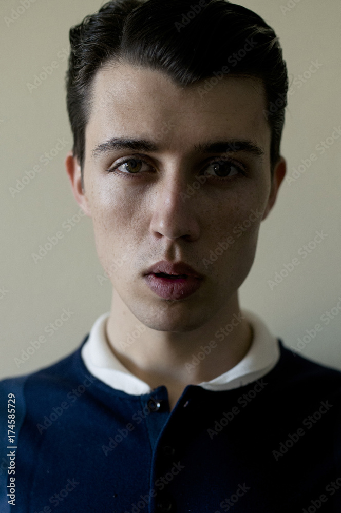 Young Man standing indoors