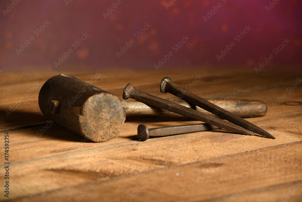 Naklejka premium Mallet and Three Metal Spikes