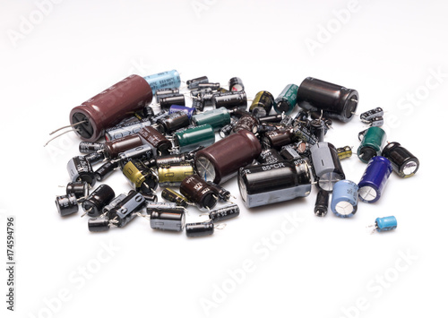 old electrolytic capacitors of different values isolated on a white background, Concept recycling 