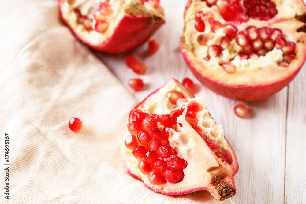 Sliced pomegranate on white background
