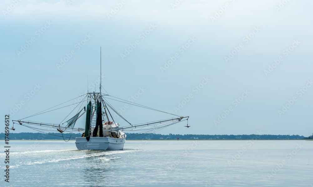 Shrimp Trawler Boat Heading to Sea in Savannah Georgia Shrimp Trawler Boat Heading to Sea in Savannah Georgia