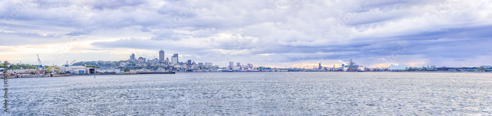 Panorama cityscape and skyline of Quebec City with Saint Lawrence river and boats during sunset