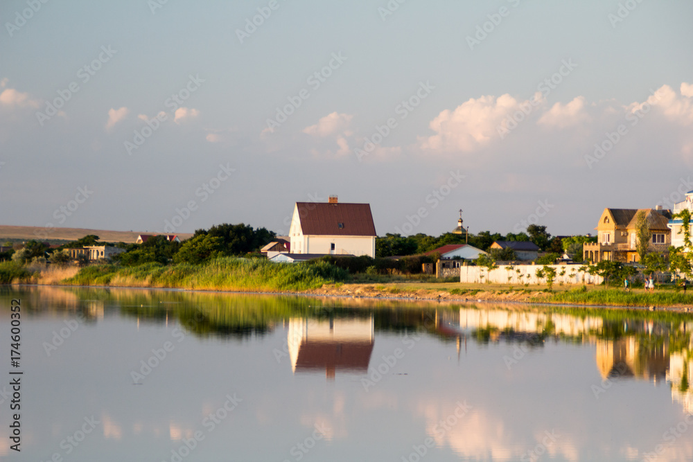 reflection of a house on the water