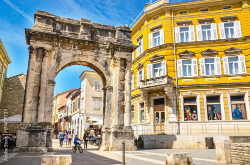 Ancient Roman triumphal arch or Golden Gate and square in Pula, Croatia, Europe