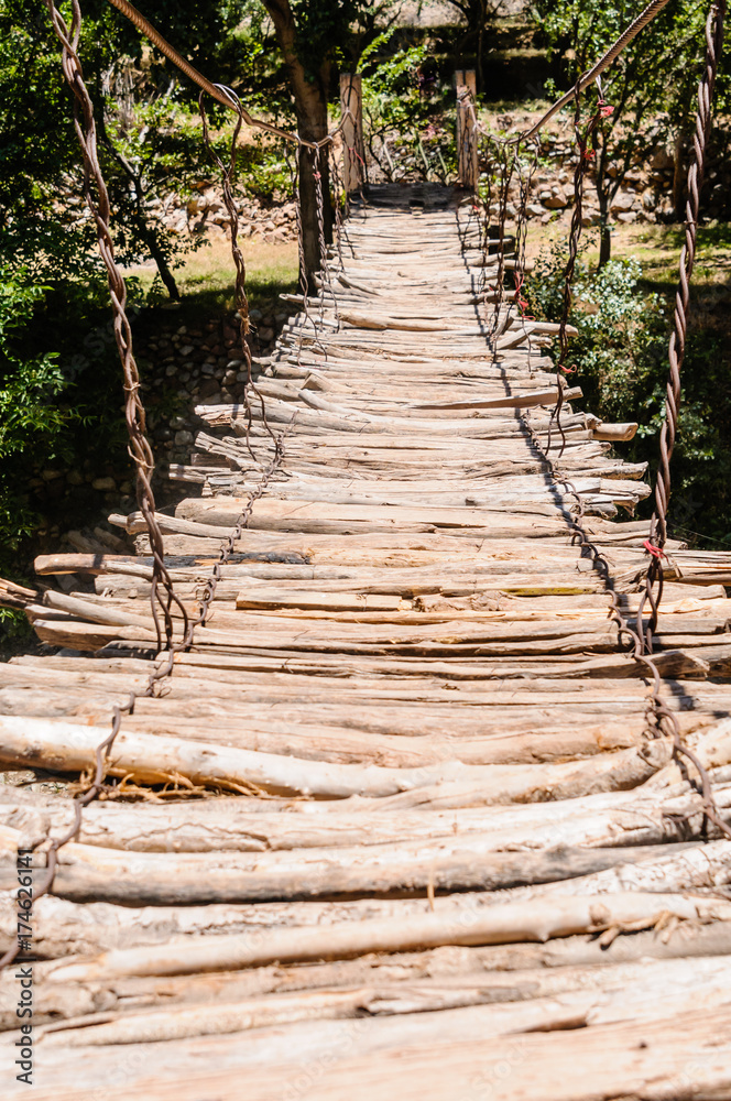 Rickety wooden bridge over the River Ourika high up in the Atlas Mountains, Morocco Rickety wooden bridge over the River Ourika high up in the Atlas Mountains, Morocco