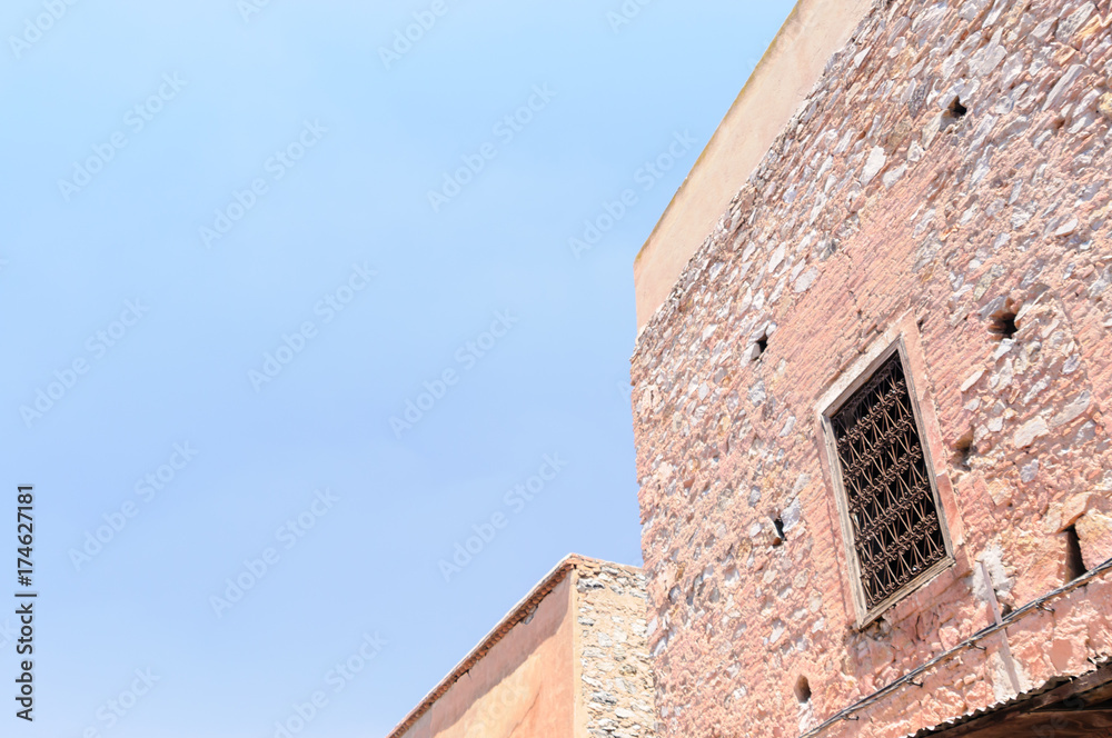 Windows covered by metal grilles on a house in the Medina in Marrakech, Morocco Windows covered by metal grilles on a house in the Medina in Marrakech, Morocco