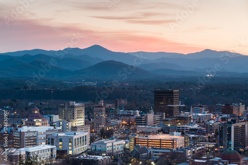 View of Asheville city skyline and mountains after sunset