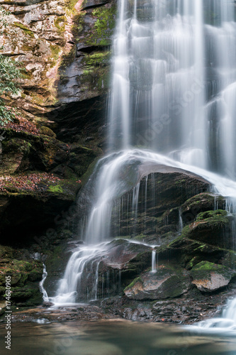 Waterfall cascade and moss covered rocks in North Carolina forest photo