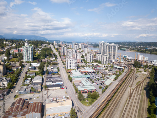 New Westminster, Greater Vancouver, BC, Canada - June 11, 2017 - Aerial view of the city, shopping mall and railroad tracks.