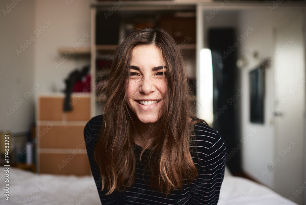 Happy woman with squint eyes looking at camera Happy woman with squint eyes looking at camera
