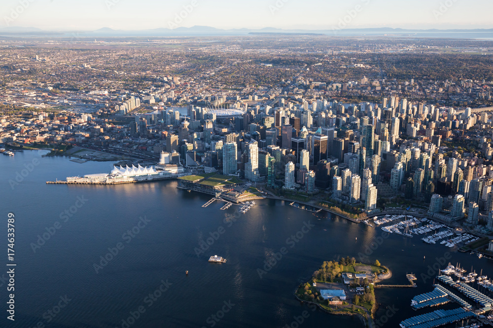 Naklejka premium Beautiful Aerial View of Vancouver Downtown, British Columbia, Canada, during a bright spring sunset.