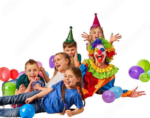 Birthday child clown playing with children. Fun of group people lying floor on white background. Holiday on the occasion of the beginning of holidays.
