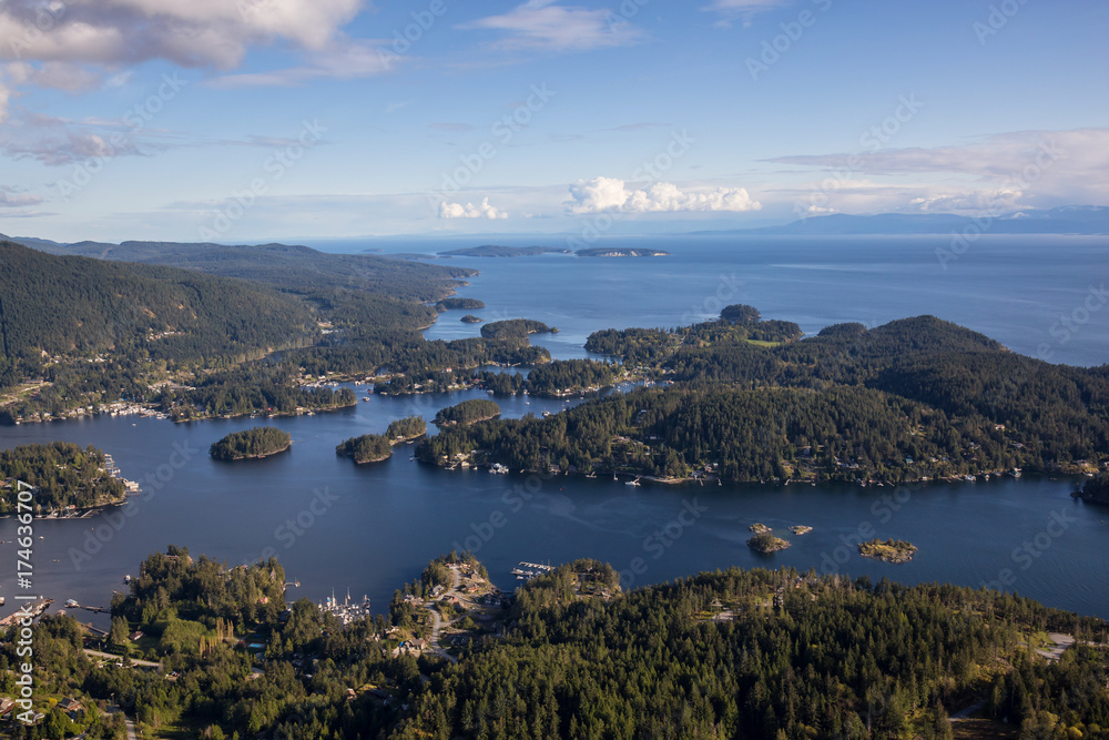 Pender Harbour in Sunshine Coast, British Columbia, Canada, during a cloudy evening from an Aerial View.