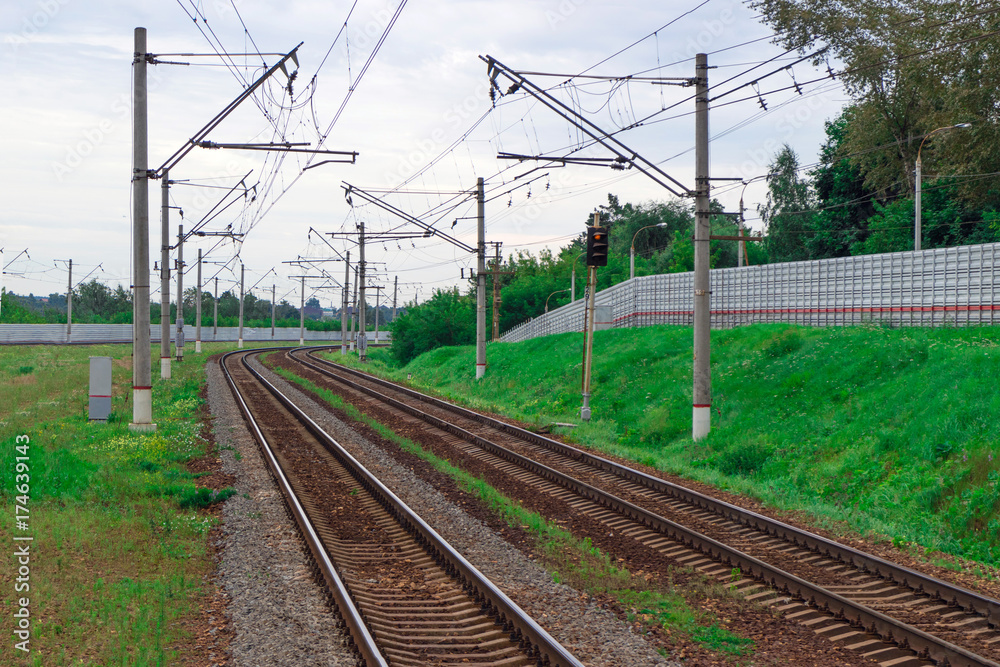 Railroad tracks going into the distance beyond the turn. Rails for commuter trains. Railroad tracks going into the distance beyond the turn. Rails for commuter trains.