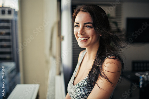 A young beautiful brunette smiling  photo