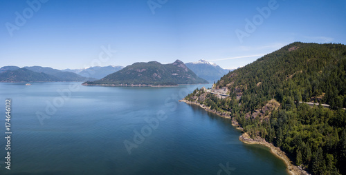Aerial Panoramic Landscape view of Howe Sound and Sea to Sky Highway. Taken North of Vancouver, British Columbia, Canada, during a sunny summer day.