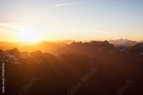Beautiful rugged mountain landscape view during a golden sunset. Taken near Tofino, Vancouver Island, British Columbia, Canada.