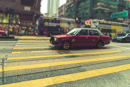taxi on city street,hong kong,china,asia.