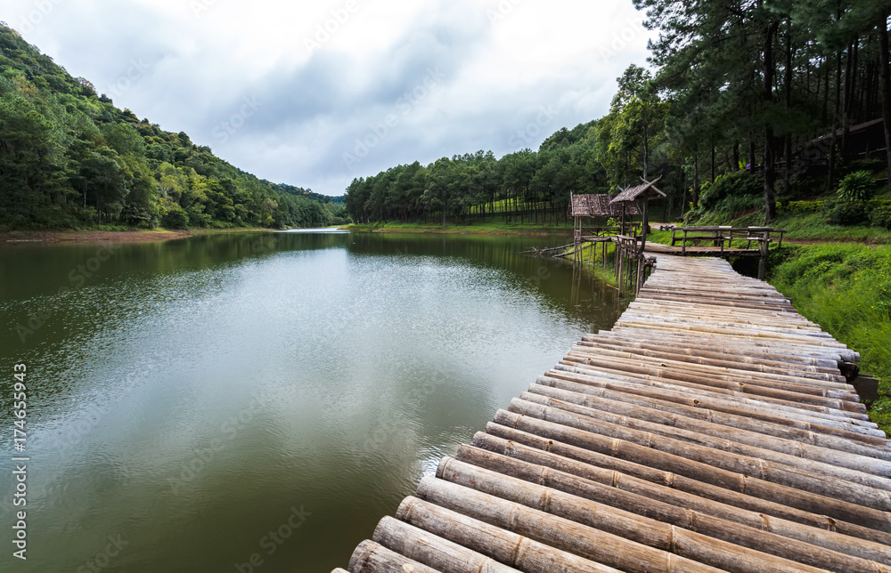 Bamboo Raft in Pang- Oung Lake park on raining day ,Mae Hong Son province,Thailand Bamboo Raft in Pang- Oung Lake park on raining day ,Mae Hong Son province,Thailand