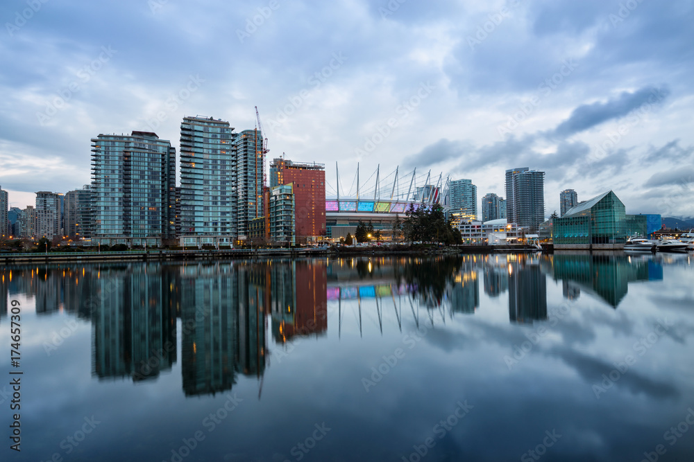 Beautiful cloudy morning sunrise with the view of False Creek in Downtown Vancouver, British Columbia, Canada.