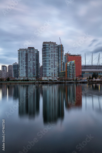 Beautiful view of False Creek with Downtown Vancouver  BC  Canada  in the Background. Picture taken during a cloudy sunrise.