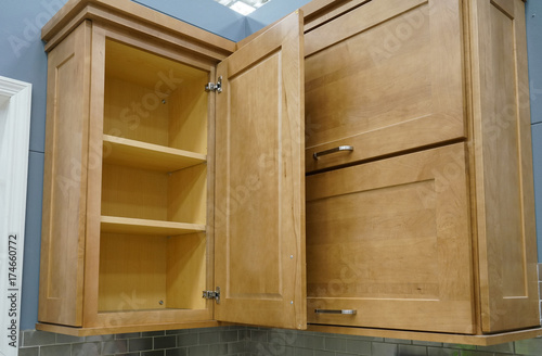Wood kitchen cabinet with door open