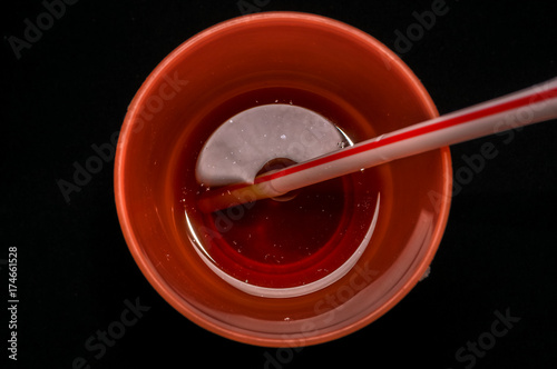 top view of glass of tea wuth straw