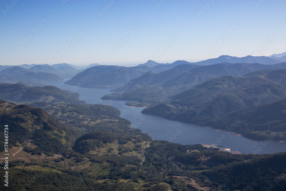 Aerial landscape view of the Inlet that leads from the Ocean to Port Alberni in Vancouver Island, British Columbia, Canada. Taken during a sunny summer day.