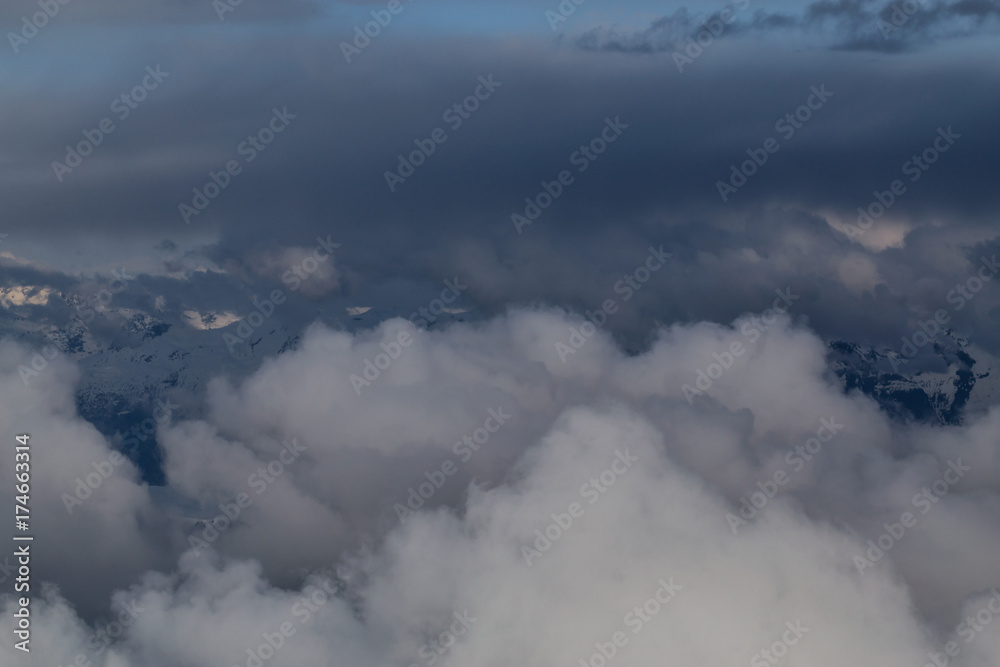 Aerial view of the Top of the Clouds. Perfect for Background Use. Taken from an airplane in British Columbia, Canada.