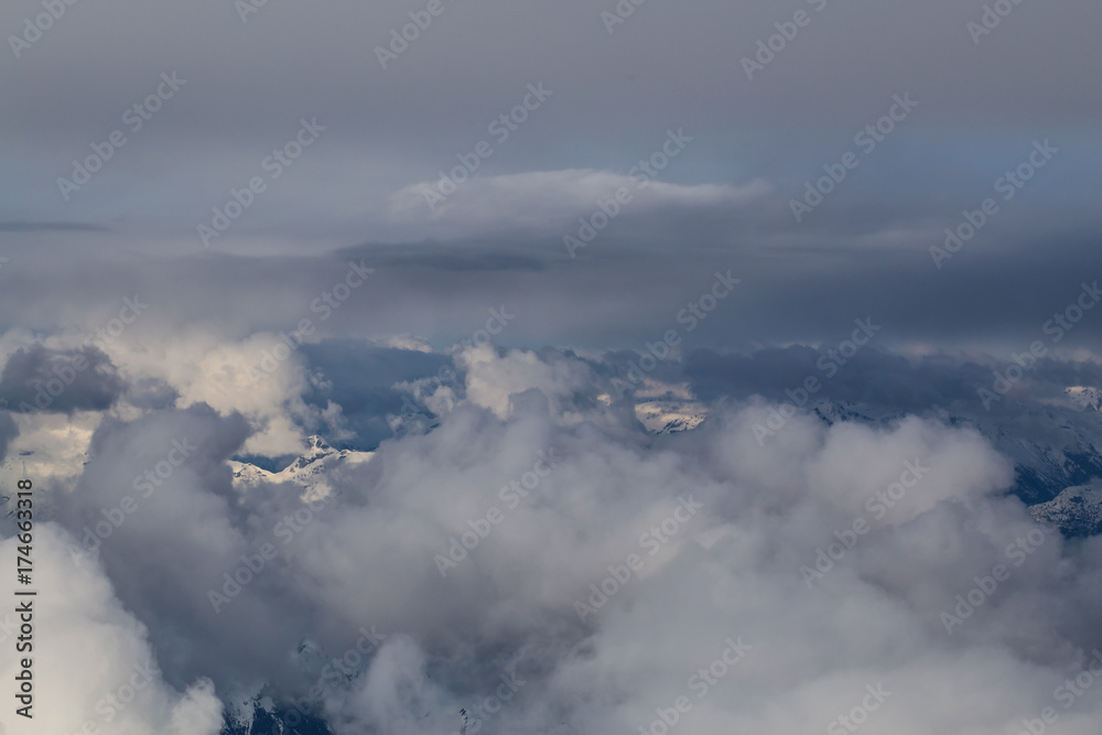 Aerial view of the Top of the Clouds. Perfect for Background Use. Taken from an airplane in British Columbia, Canada. Aerial view of the Top of the Clouds. Perfect for Background Use. Taken from an airplane in British Columbia, Canada.