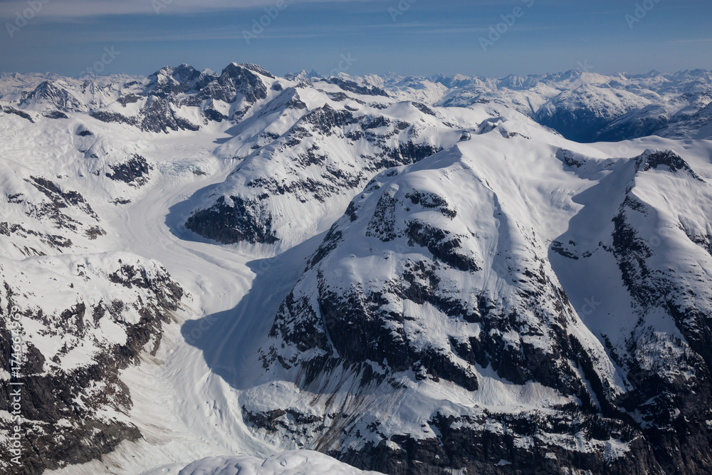 Aerial landscape view of the mountains. Taken far remote North West from Vancouver, British Columbia, Canada. Aerial landscape view of the mountains. Taken far remote North West from Vancouver, British Columbia, Canada.