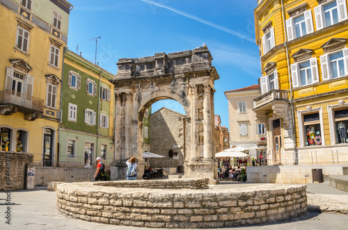 Ancient Roman triumphal arch or Golden Gate and square in Pula, Croatia, Europe photo