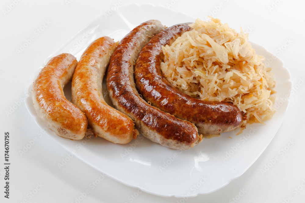 Oktoberfest food menu, plate of sausages and sauerkraut. Oktoberfest food menu, plate of sausages and sauerkraut.