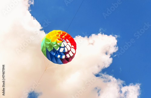 Colorful kite free to fly in the clear sky, © kolyadzinskaya