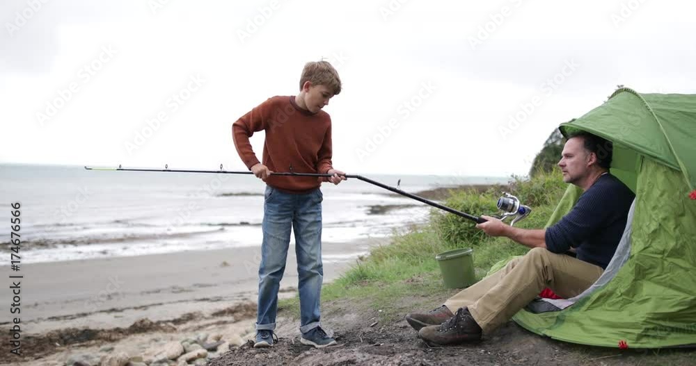 Father teaching Son how to fish Father teaching Son how to fish