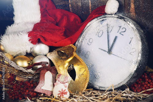 Christmas still life , clocks and Christmas decorations covered with snow . Christmas holidays