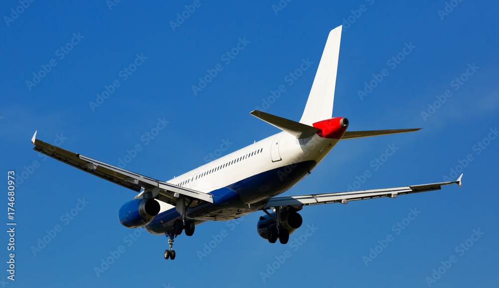 Fototapeta premium Passenger plane departing in afternoon