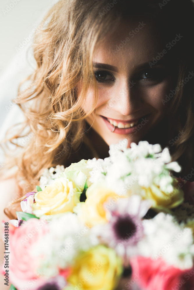Luxury bride in white dress posing while preparing for the wedding ceremony Luxury bride in white dress posing while preparing for the wedding ceremony