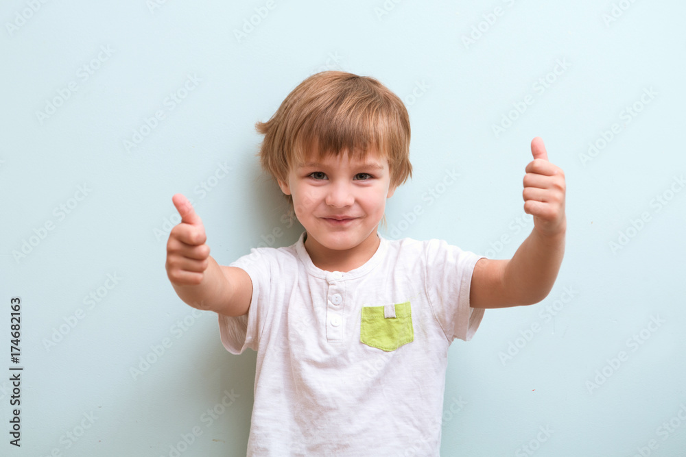 Happy little boy showing thumb up Happy little boy showing thumb up