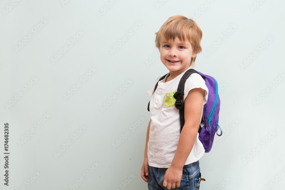 Cheerful smiling little kid with backpack. Cheerful smiling little kid with backpack.