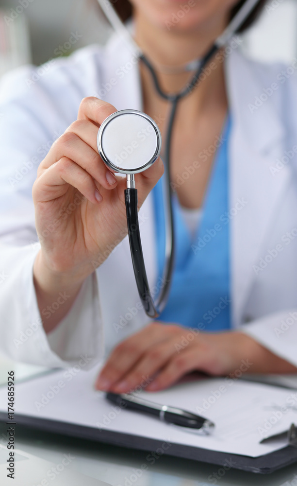 Doctor with a stethoscope in the hands, close up. Physician ready to examine and help patient. Medicine, healthcare and help concept Doctor with a stethoscope in the hands, close up. Physician ready to examine and help patient. Medicine, healthcare and help concept