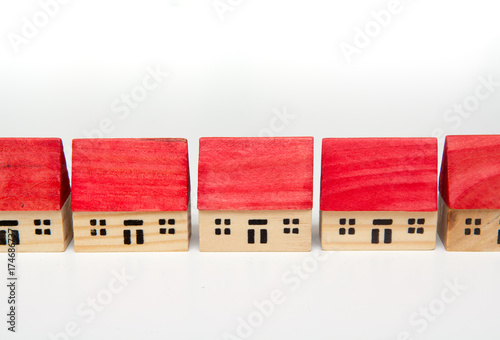 row of model houses on a white background
