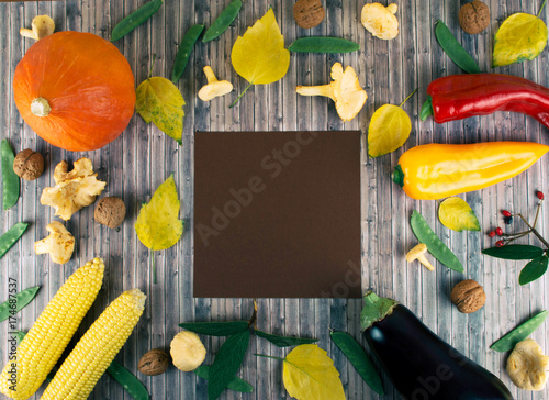Fresh autumn seasonal vegetables on wooden background.